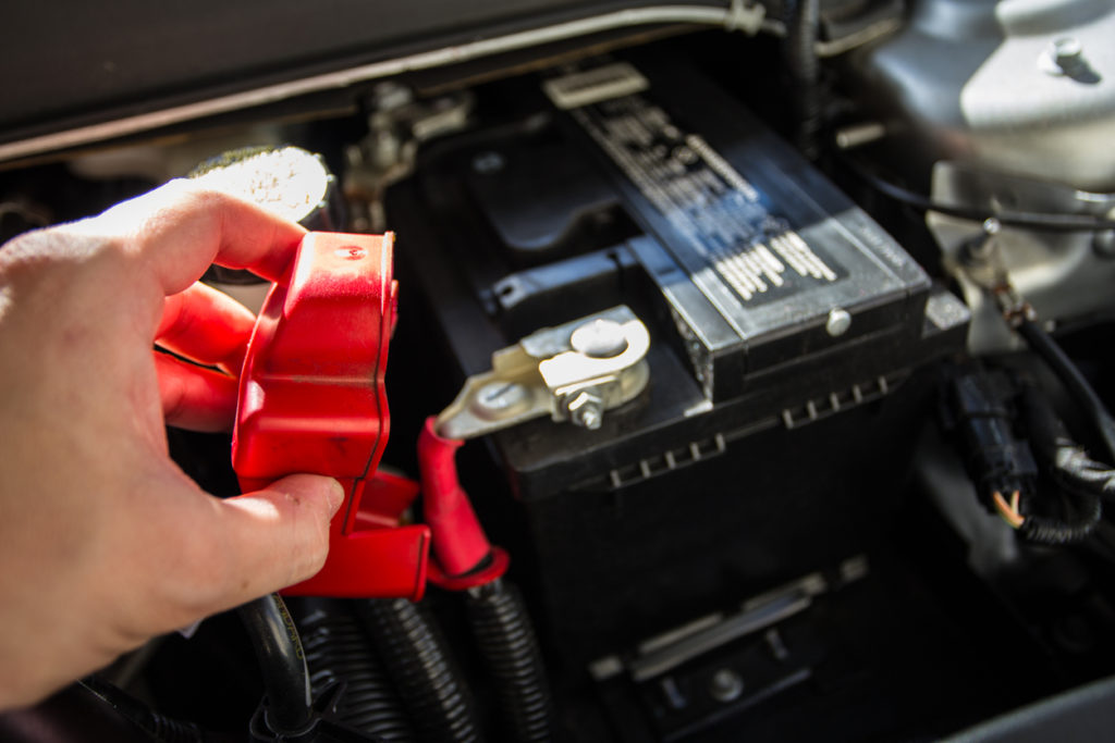 Mechanic checking car battery